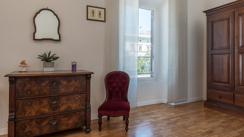 Detail of one of the bedrooms in the Via Mecenate rental apartment in Rome, Italy
